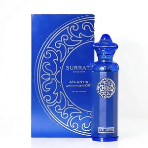 May include: A blue perfume bottle and box set. The bottle is cylindrical with a decorative cap and a silver emblem. The box is blue with silver decorative patterns and the text "SURRATI" and "ATLANTIS".