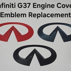 May include: Three Infiniti G37 engine cover emblem replacements in red, dark blue, and black. The text Infiniti G37 Engine Cover Emblem Replacement is printed above the three emblems, which feature the iconic oval and triangle logo design.