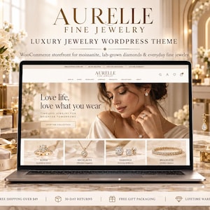 以下が含まれることがあります： Aurelle Fine Jewelryのウェブサイトを表示したノートパソコン。ジュエリーを身に着けた人物のバナー画像、ナビゲーションメニュー、指輪、ネックレス、イヤリング、ブレスレットの製品カテゴリーとテキストが掲載されたホームページが表示されています。