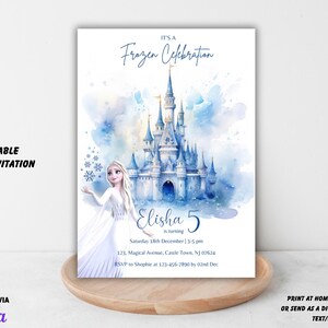 May include: A 5x7 inch invitation with a watercolor illustration of a blue castle and a character from the movie Frozen. The invitation reads "It's a Frozen Celebration" and includes event details.