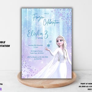 May include: Editable 5x7 invitation for a Frozen themed birthday party. The invitation features a purple and blue background with snowflakes and a picture of Elsa from Frozen. The text on the invitation reads "It's a Frozen Celebration, Elisha 3 is turning".