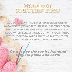 May include: Image with text: "CARE FOR KNITTED TOYS." Instructions include washing with baby shampoo, rinsing, and drying flat. Pink yarn balls, crochet hooks, and lace ribbon are also visible.