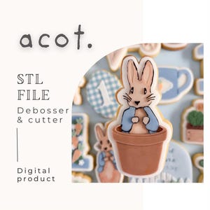 May include: A digital product image featuring a Peter Rabbit cookie cutter design. The cookie is shaped like Peter Rabbit in a flower pot, with blue and brown accents. The image also includes the text "acot." and "STL FILE Debosser & cutter Digital product."