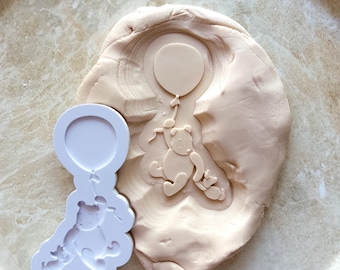 Vintage pooh bear and piglet hanging from balloon debosser and cutter