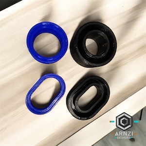 May include: Four different sized rings, two blue and two black. The rings are made of a rubber-like material and have a smooth finish.