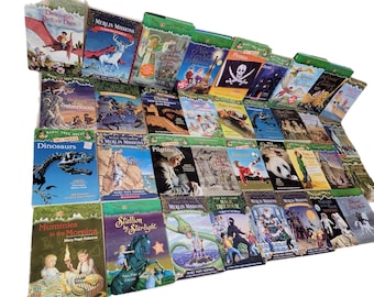 May include: A collection of Magic Tree House books with various titles, including "Dinosaurs Before Dark", "Merlin Missions", "Mummies in the Morning", and "Stallion by Starlight". The books are arranged in a row, with the spines facing the viewer. The books are all green and have a similar design.
