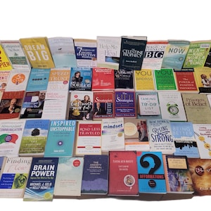 May include: A collection of self-help and motivational books with various titles and authors. The books are arranged in a grid pattern and feature a variety of colors and designs.