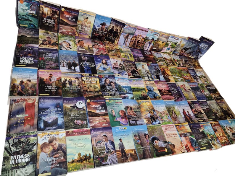 May include: A large collection of paperback books with various titles and covers. The books are arranged in rows and columns, creating a colourful and textured display.