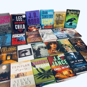 May include: A collection of paperback books with various titles and authors. The books are stacked in a pile, with some of the titles visible. The books are all different colors and sizes.