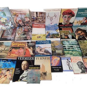 May include: A collection of art books featuring various artists, including Picasso, Monet, Van Gogh, and Cezanne. The books are arranged in a grid pattern and cover a range of art movements and styles.