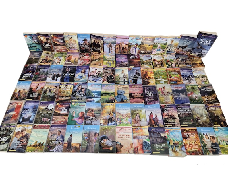 May include: A large collection of paperback books with various titles and covers. The books are arranged in rows and columns, and they are all in good condition.
