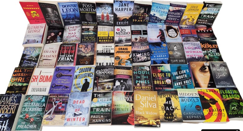 May include: A large collection of paperback books with various titles and authors. The books are arranged in rows and columns, and many of the covers feature colorful illustrations and text.
