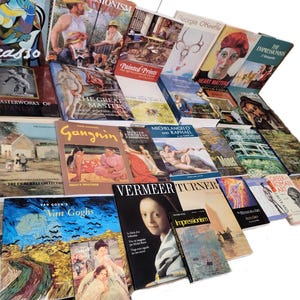 May include: A collection of art books featuring various artists, including Picasso, Monet, Van Gogh, and Turner. The books are arranged in a staggered pattern, with the spines facing outward. The covers of the books are colorful and feature images of famous paintings.