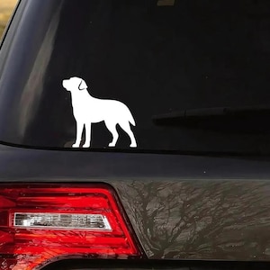 A solid white Labrador retriever decal without a heart cutout is applied to the back window of a gray car.