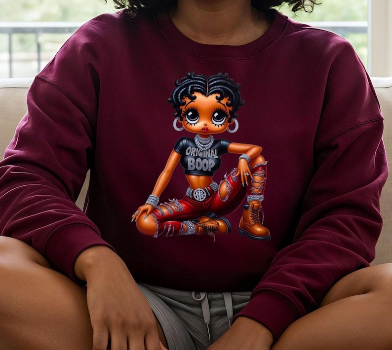 Maroon Betty Boop Sweatshirt Vintage Cartoon Character Classic Animation Design Retro Streetwear Style Pop Culture Icon Cotton Crewneck Collector Item Fashion Statement Comfortable Everyday Wear Trendy Apparel Gift Nostalgic Animation Fan