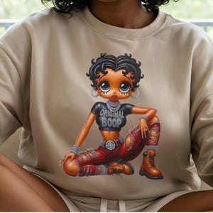 Cartoon Character Sweatshirt  Sand Betty Boop Design Vintage Animation Style Cotton Crewneck Top Retro Pop Culture Fashion Classic Streetwear Collection Comfortable Everyday Wear Trendy Apparel Gift Collector Item Present Iconic Animation