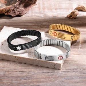 May include: Three medical alert bracelets with different colored bands. The bracelets are made of stainless steel and have a medical symbol and text that reads "Type 1 diabetes Insulin dependent Blood Thinner Eliquis ICE: 123-456-7890".