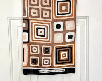 Modern abstract tea towel Chinese Puzzle by Ulster in Irish linen, concentric squares in peach brown black white, geometric boxes wall art