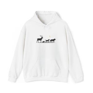 May include: White hooded sweatshirt with a kangaroo pocket. The front features a black silhouette design of a deer, a small animal, two dogs, and a wolf under a crescent moon. The sweatshirt has a drawstring hood and long sleeves.