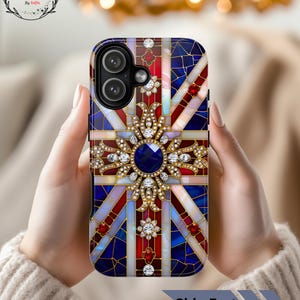 May include: A phone case featuring a Union Jack design with a jeweled embellishment. The case has a blue, red, and white color scheme with a central jewel and smaller gems. The text "Ship Fast" is visible.