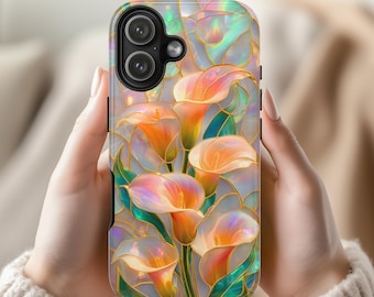 May include: A phone case featuring a vibrant, iridescent stained-glass style design of orange and yellow calla lilies with green leaves, outlined in gold. The case has a black camera module cutout and a glossy, reflective finish throughout.