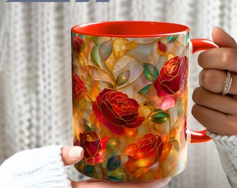 May include: A ceramic mug with a vibrant stained glass pattern featuring deep red roses, golden yellow foliage, and green leaves. The mug has a bright orange interior and a matching orange handle. The text Ship Fast is printed in the upper left corner.