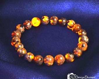 UV Reactive Yooperlite Stretch Bracelet | 8mm Fire Stone Beads, Glow Under UV Light,  Mystical Healing Crystal Jewelry Gift