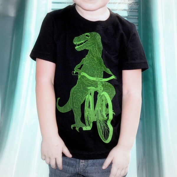 Kids DINOSAUR t rex on bicycle T-Shirt (Sizes 2-12)