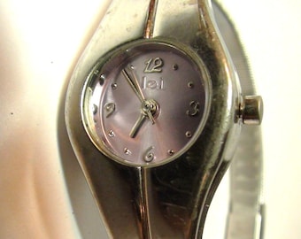 Lei Wrist Watch Silver tone and Purple Face with Silver  Bracelet Vintage from 1981 is working New Battery