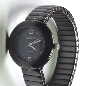 Black Enamel a Beauty 1990s Rumours Quartz Watch Classic Look with Stretchable Band it is Working and keeping time image 1