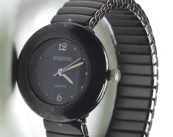 Black Enamel a Beauty 1990s Rumours Quartz Watch Classic Look with Stretchable  Band it is  Working  and keeping time