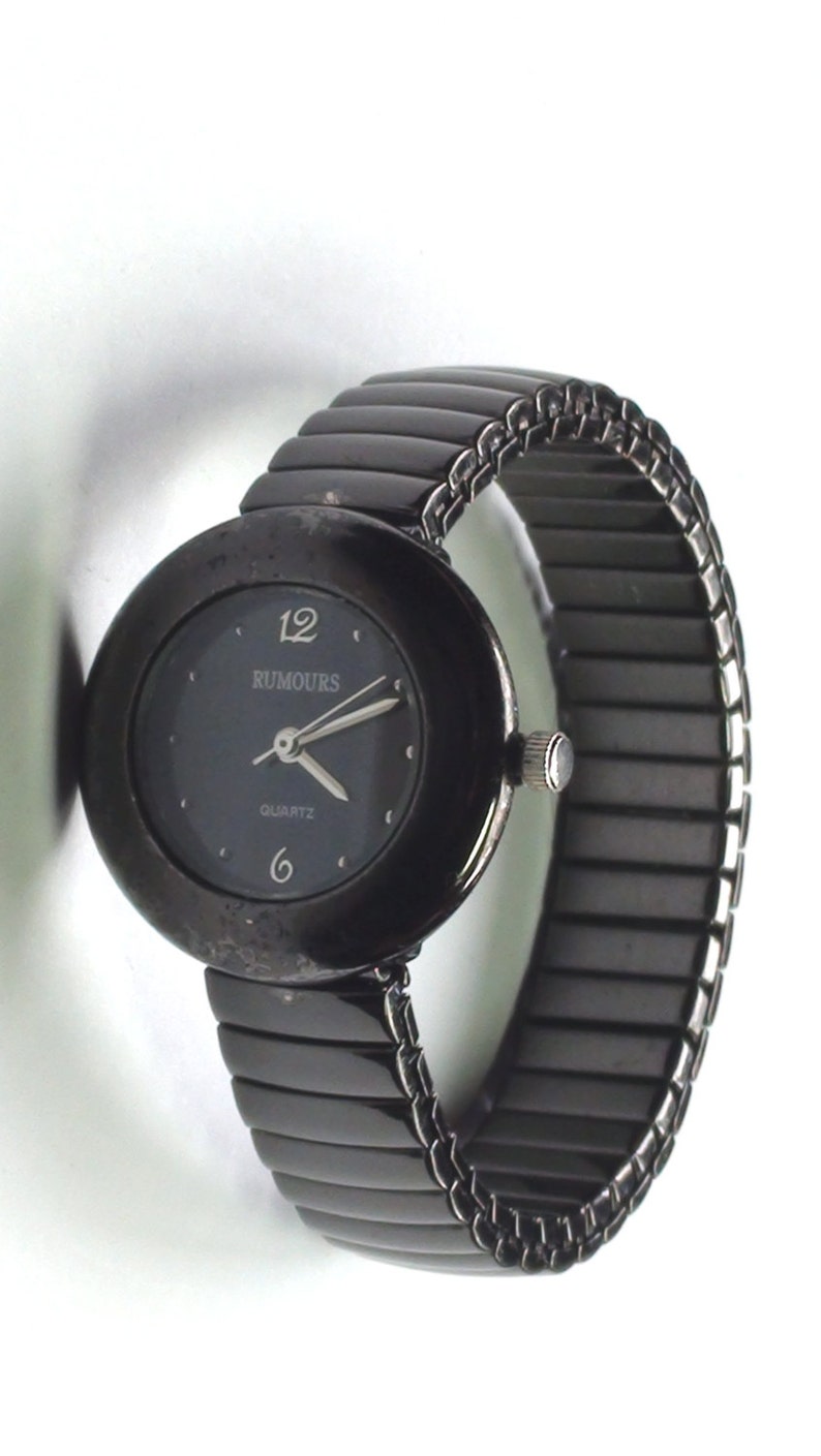 Black Enamel a Beauty 1990s Rumours Quartz Watch Classic Look with Stretchable Band it is Working and keeping time image 1