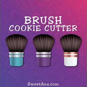 May include: Three cookie cutters shaped like makeup brushes. The brushes are in different colors: blue, purple, and white. The text "BRUSH COOKIE CUTTER" is at the top of the image.