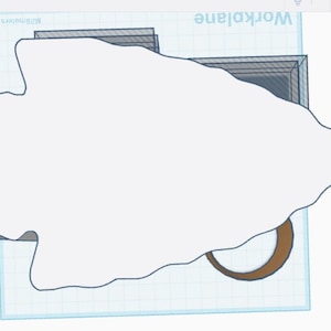 May include: A white arrowhead shape, possibly a 3D model, is the central focus. It's set against a light blue grid background, with a brown crescent shape at the bottom. The word "workplane" is visible in the background.