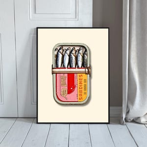 The lid of the tin is vibrant, divided into a bold red and yellow design with a retro feel. On the right side, "Sardines in Olive Oil" is printed in striking yellow and orange lettering, giving it a nostalgic touch.