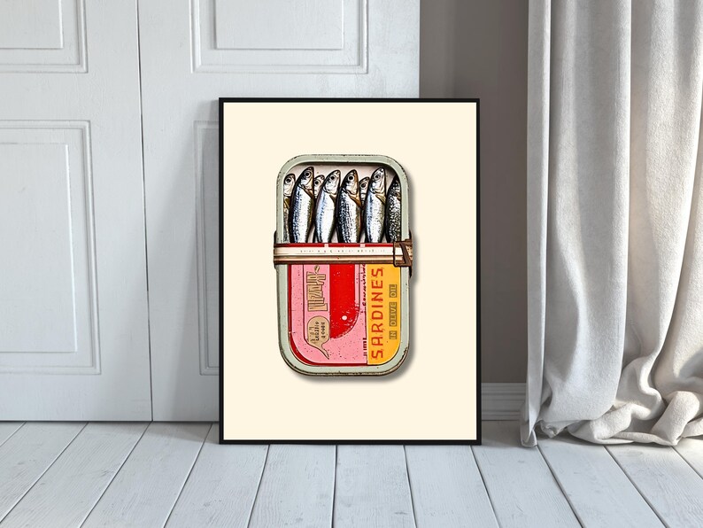 The lid of the tin is vibrant, divided into a bold red and yellow design with a retro feel. On the right side, "Sardines in Olive Oil" is printed in striking yellow and orange lettering, giving it a nostalgic touch.