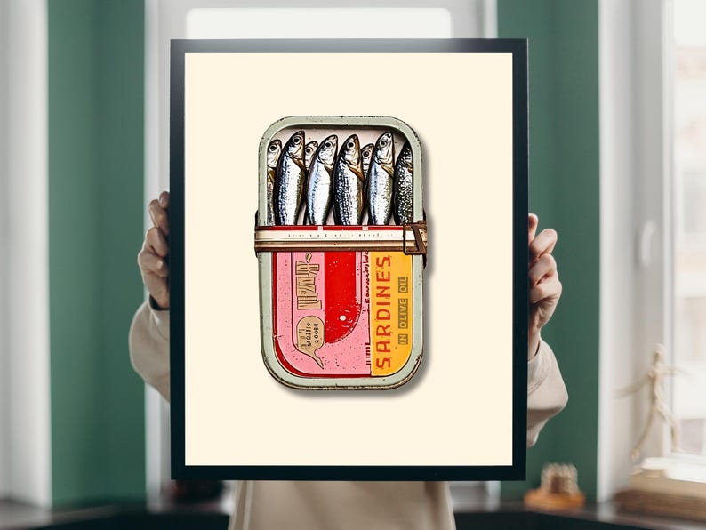 The soft beige background provides a neutral backdrop that enhances the vivid red and yellow hues of the tin. The silvery sardines and muted green rim further balance the composition, creating a visually appealing contrast.