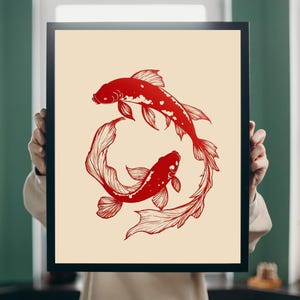 Puede incluir: Una impresión enmarcada de dos peces koi rojos nadando en círculo sobre un fondo crema.