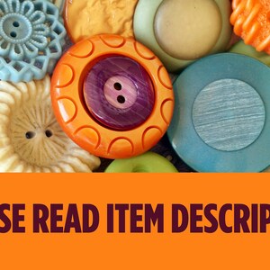 May include: A collection of colorful vintage buttons in various shapes and sizes. The buttons are in shades of blue, orange, green, and cream. The text "PLEASE READ ITEM DESCRIPTION" is displayed on an orange banner.