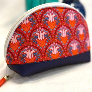 Dumpling Pouch Carry-all with Tassel in Bright Floral Pattern. 9 x 5.5 inches.
