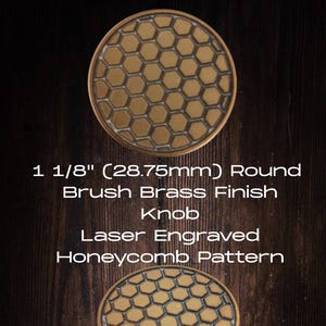 May include: Two round, brushed brass finish knobs with a laser-engraved honeycomb pattern. The knobs are 1 1/8" (28.75mm) in diameter. The text on the image reads: "1 1/8" (28.75mm) Round Brush Brass Finish Knob Laser Engraved Honeycomb Pattern."