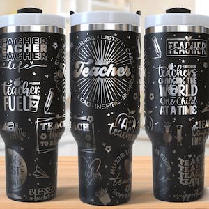 May include: Black stainless steel travel mug with a silver design featuring the words "Teacher" and "Teacher Fuel". The mug has a handle and a lid.