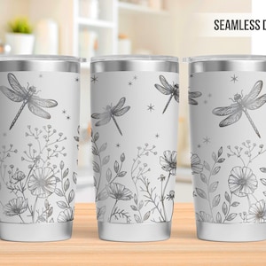 Puede incluir: Tres vasos de acero inoxidable blanco con un diseño sin costuras que presenta una libélula plateada y un patrón floral.