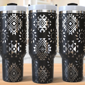 May include: Three stainless steel travel mugs with black and silver geometric patterns. The mugs have a handle and a lid. The text "Seamless Design" is visible in the bottom right corner of the image.