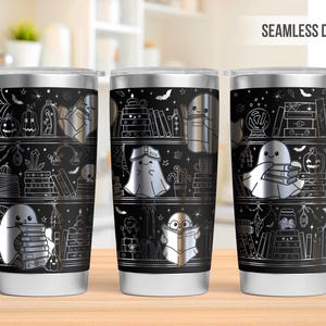 May include: Three stainless steel tumblers with a black background and a seamless design. The design features shelves with books, pumpkins, and ghosts. The text "SEAMLESS DESIGN" is at the top.
