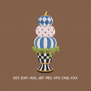 May include: A decorative embroidered design featuring a stacked pumpkin topiary. The top pumpkin has a blue and white diamond pattern, the middle one has pink polka dots, and the bottom one has blue and white stripes. The base is a black and white checkered pattern.