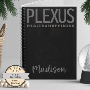 May include: Black spiral-bound journal with the text "PLEXUS HEALTH&HAPPINESS". The journal is 8" x 6" travel size and lined. The name "Madison" is printed on the cover. A custom gift.