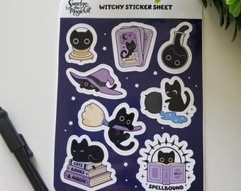May include: A sheet of witchy stickers featuring black cats, spell books, witch hats, and potion bottles. The stickers have a dark blue background with white stars and the text "Witchy Sticker Sheet". The stickers are designed with a cartoon style.