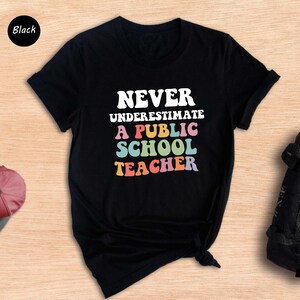 Never Underestimate A Public School Teacher Kamala Harris Shirt, Harris Walz 2025 Rally Tee, Tim Walz Dnc Quote Sweatshirt, Educator Gift