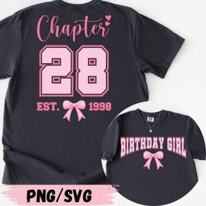 May include: Dark navy blue t-shirt with pink text and graphics. The back of the shirt says "Chapter 28" with the year "1998" and a bow graphic. A smaller image shows a shirt that says "Birthday Girl" with a bow.